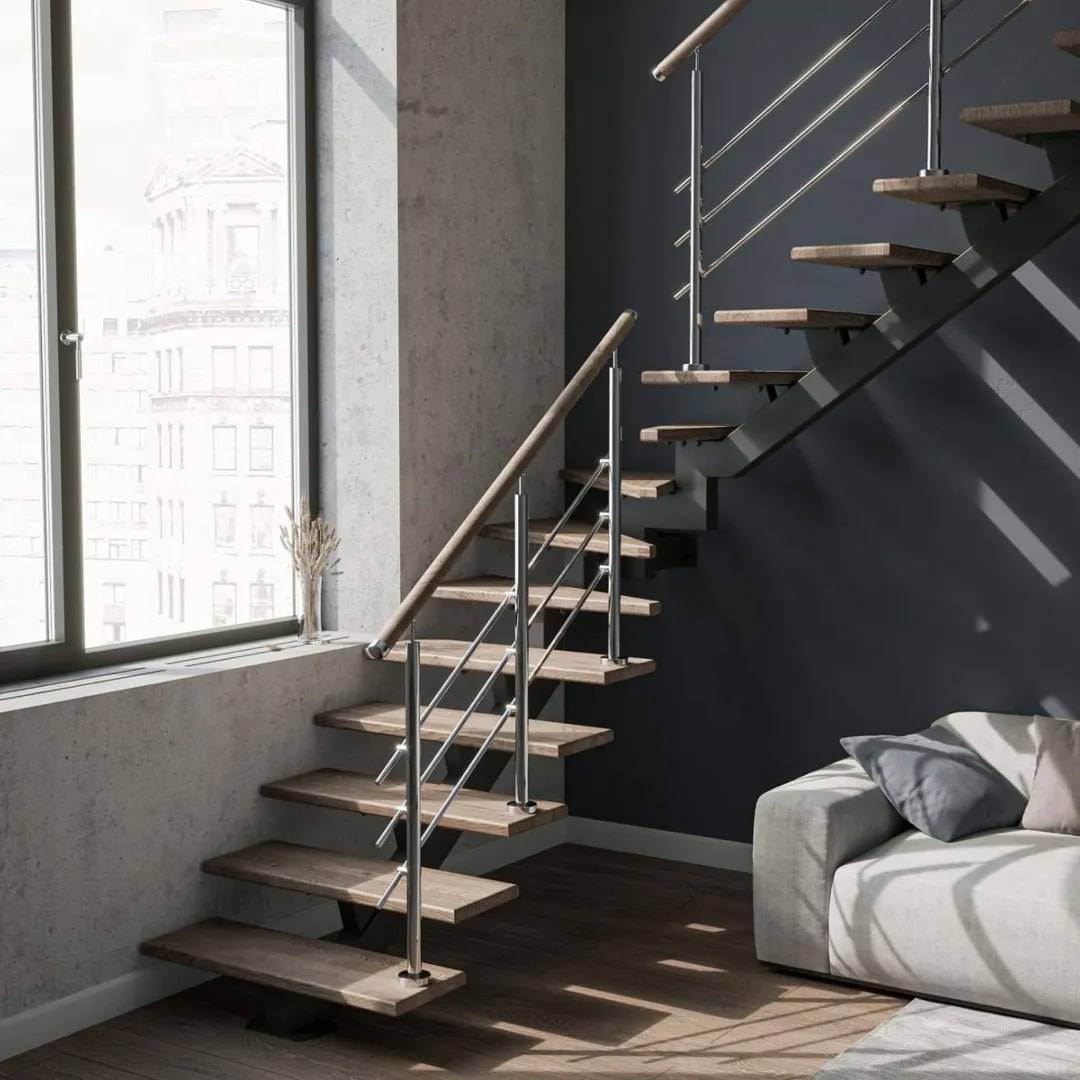 Floating staircase with central steel spine and cantilevered open-riser wood treads