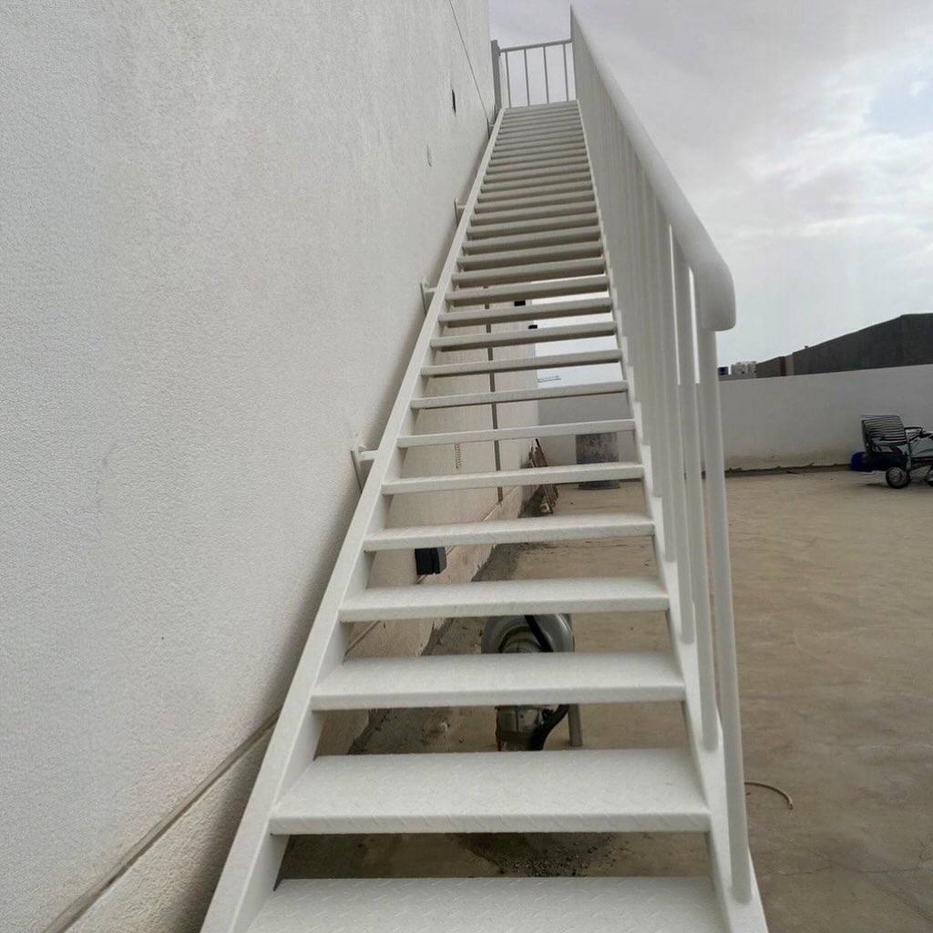 Galvanized steel exterior straight staircase on a London rooftop