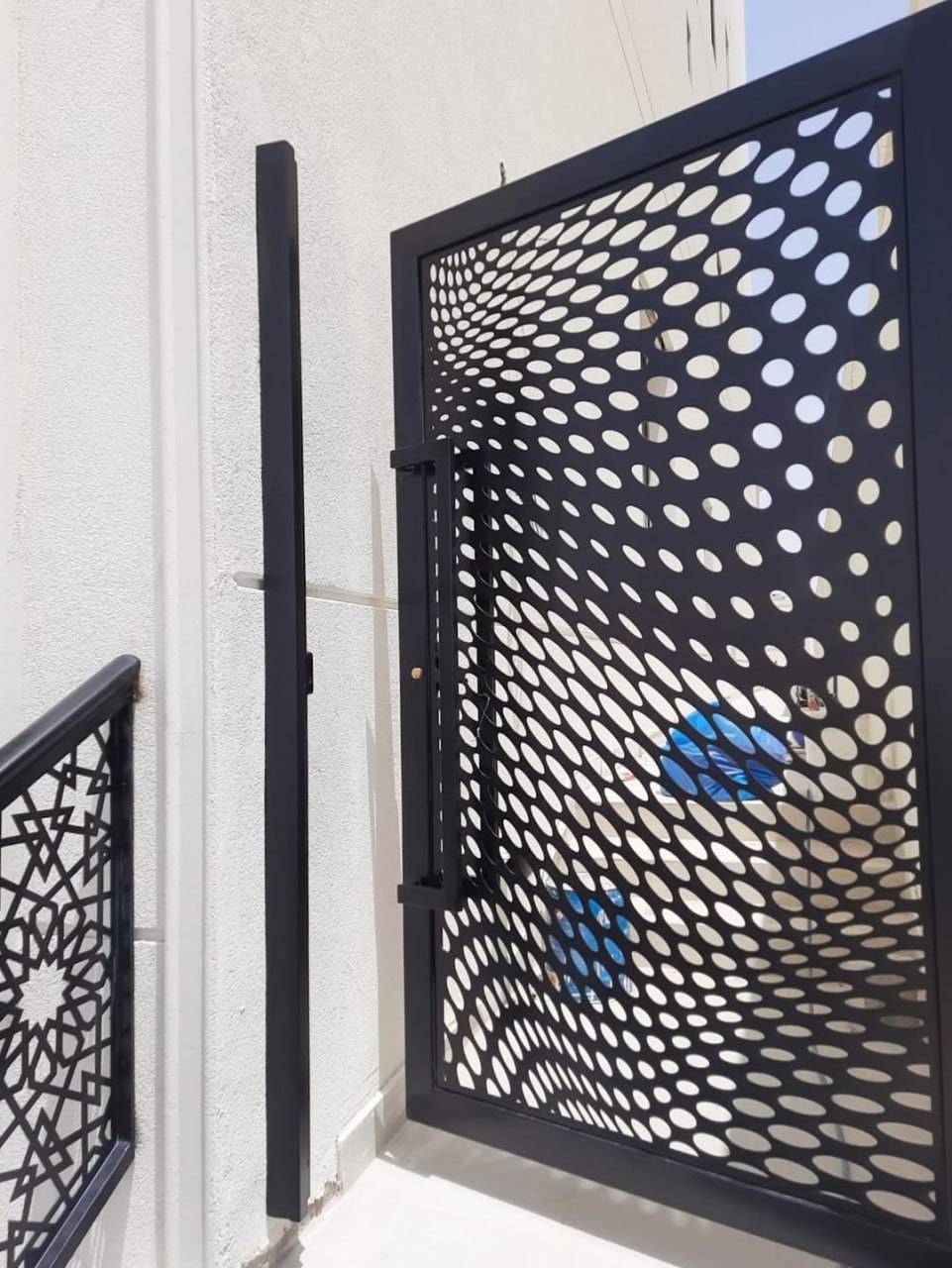 Close-up detail of precision laser-cut steel architectural panel